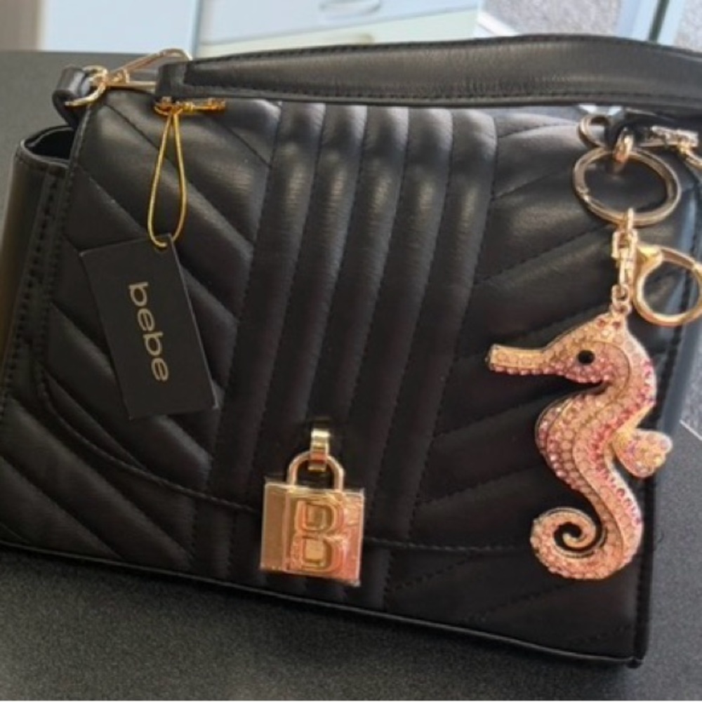 bebe Black Quilted Shoulder Bag with Gold Hardware and Pink Seahorse Charm